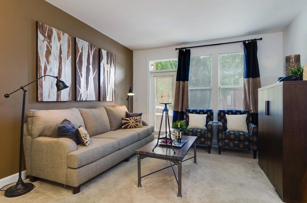 Carpeted living area with patio at Capitol Gateway in Atlanta, Georgia